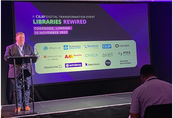 Nick Poole welcoming all guests at Rewired 2023 with Tineyi Padiwa sitting in the front row